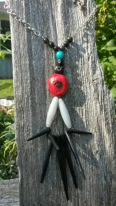 CREATURE ( sterling silver, red coral, blue jade, lava stone, hypersinth, vintage wood beads (c 1970s)